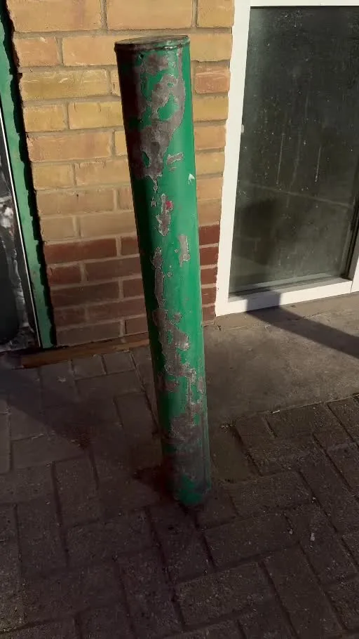 Rear entrance and green bollard before the colour change